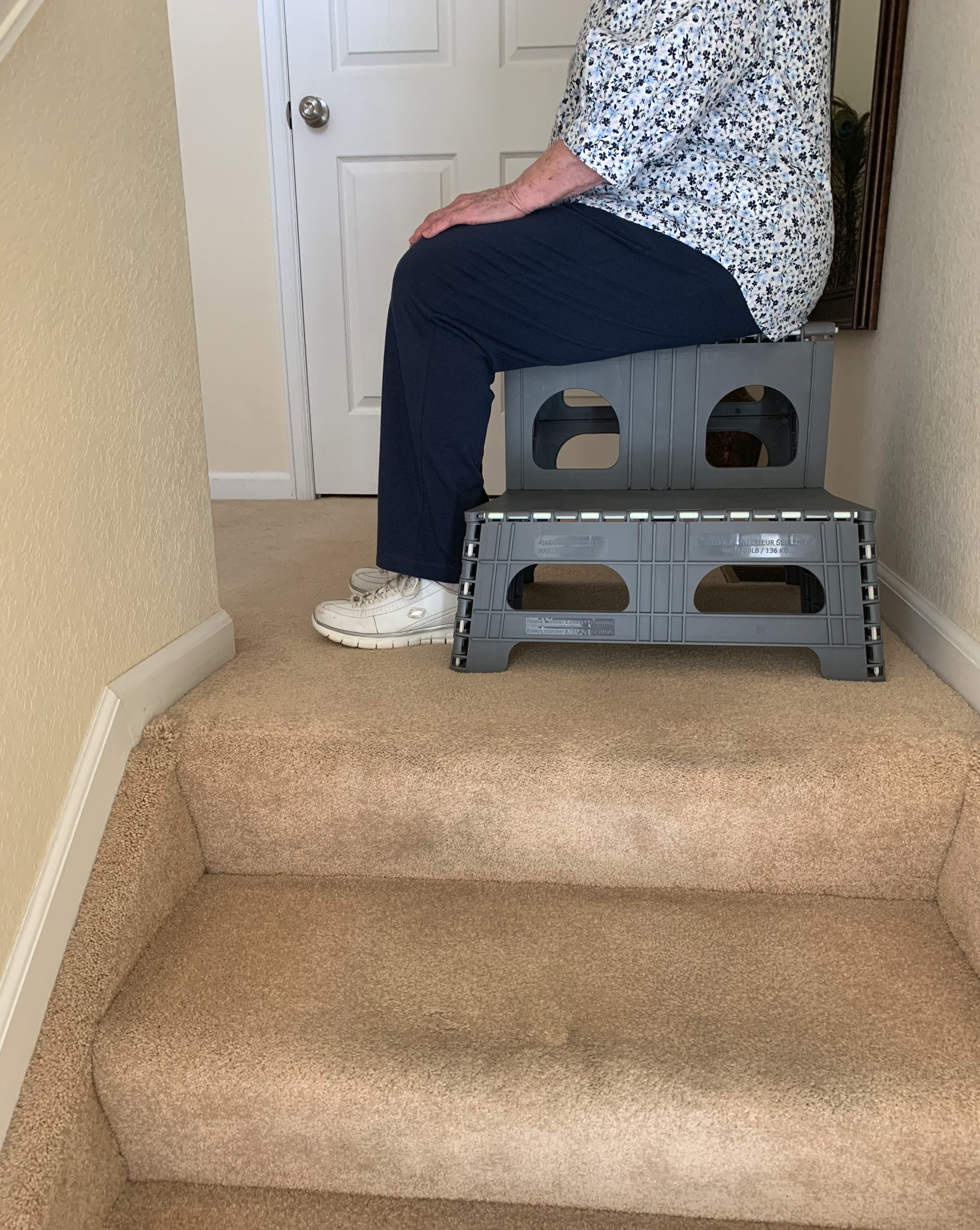 This device sits on the landing at the top of the stairs and allows you to scoot up tow more steps so that you don't have to get up from the floor but rather just stand from a seated position.